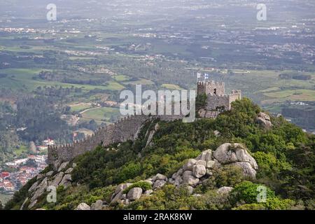 The Castelo dos Mouros, or Castle of the Moors on the Sintra Hills above the historic town of Sintra, Portugal. The medieval castle built during the Moorish occupation in the 8th century dominates the hillside over Sintra. Stock Photo