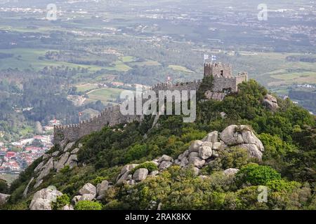 The Castelo dos Mouros, or Castle of the Moors on the Sintra Hills above the historic town of Sintra, Portugal. The medieval castle built during the Moorish occupation in the 8th century dominates the hillside over Sintra. Stock Photo