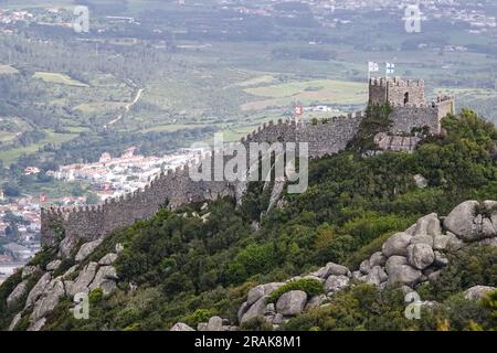 The Castelo dos Mouros, or Castle of the Moors on the Sintra Hills above the historic town of Sintra, Portugal. The medieval castle built during the Moorish occupation in the 8th century dominates the hillside over Sintra. Stock Photo
