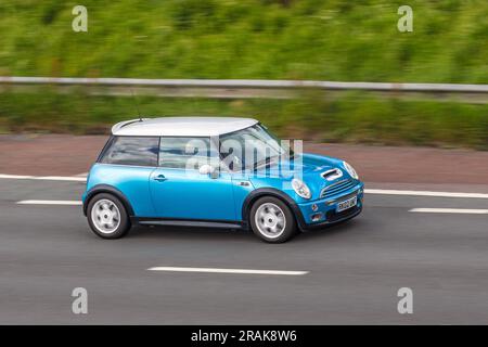 2002 Blue Mini Cooper S Car Hatchback Petrol 1598 cc travelling at speed on the M6 motorway in Greater Manchester, UK Stock Photo