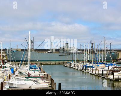 View of SS Jeremiah O'Brien historic WW2 ship moored at Pier 35 seen from Pier 39 marina San Francisco California USA Stock Photo