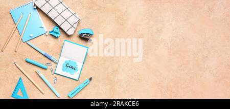 Sticky note with word GOAL and stationery on grunge background with space for text Stock Photo