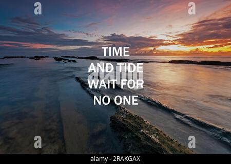 Sunset background with life inspirational quotes - Time and tide wait for no one Stock Photo