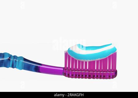 Toothpaste on the tooth cheek. Toothpaste squeezed onto a toothbrush, Healthy lifestyle concept. Copy space. Stock Photo