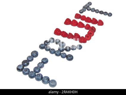 The word fruit made from pieces of raspberry and blueberry Stock Photo