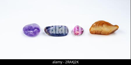 different colorful Semi Precious stones on white background Stock Photo