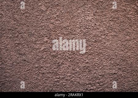 Pale subdued flat tone bronze textured background. Stock Photo