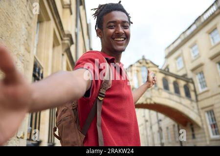 Young Man Travelling On Vacation Taking Selfie Sightseeing In Oxford By Bridge Of Sighs Stock Photo