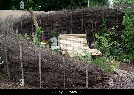 East Molesey, Surrey, UK. 3rd July, 2023. A snug corner made from hazel by the team at RHS Wisley. The RHS Hampton Court Garden Festival in the grounds of Hampton Court Palace. This year is the 30th Anniversary of the Festival and it will be taking place from 4th July to 9th July. Credit: Maureen McLean/Alamy Stock Photo