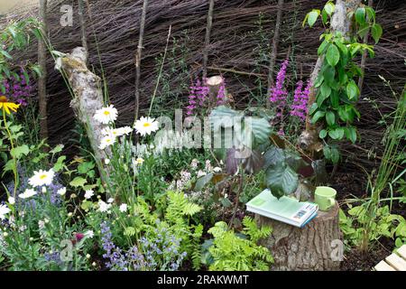 East Molesey, Surrey, UK. 3rd July, 2023. A snug corner made from hazel by the team at RHS Wisley. The RHS Hampton Court Garden Festival in the grounds of Hampton Court Palace. This year is the 30th Anniversary of the Festival and it will be taking place from 4th July to 9th July. Credit: Maureen McLean/Alamy Stock Photo