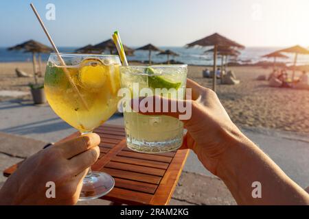 Drinking cocktails in a beach bar in Porto Portugal Porto tonic . Stock Photo