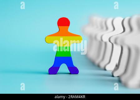 A lot of white figurines and one colored figurine as symbol of diversity Stock Photo