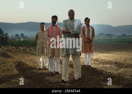 Beautiful portrait composition of Indian farmers standing in field ...