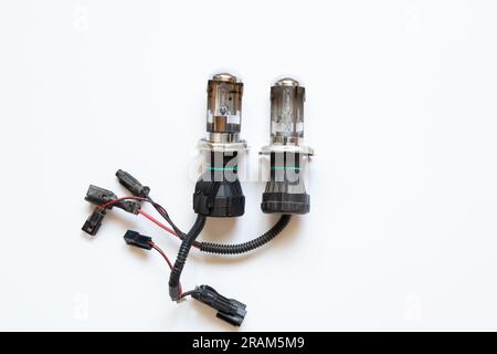 Xenon lamp for a car on a white background close-up, headlight repair and replacement Stock Photo