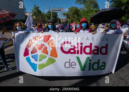 Tegucigalpa, Honduras - November 25, 2022: Women with a Big Sign that Reads 'Quality of Life Association' in a Protest for the International Day for t Stock Photo