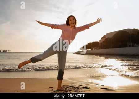 Portrait Of Positive Middle Aged Woman Having Fun At The Beach Stock Photo