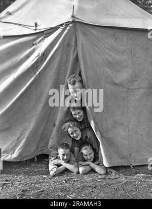 Banff, Alberta, Canada:  c. 1934 A family camping in Banff poses for an unusual family portrait. Stock Photo