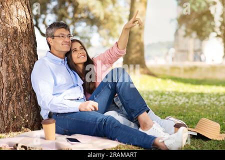 Romantic Middle Aged Couple Having Picnic In Summer Park Stock Photo