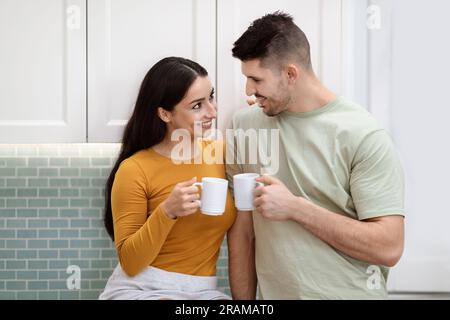 Portrait of beautiful young couple enjoying morning coffee together Stock Photo