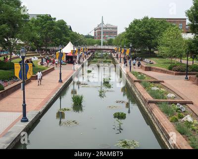 People enjoying Carroll Creek Park in Frederick, Maryland, June 3, 2023, © Katharine Andriotis Stock Photo