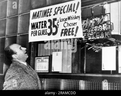 New York, New York:  December 14, 1949 A water shortage in New York City has led 'Rudy's Rail' bar and restaurant to offer water at $.35 a glass along with a free whiskey chaser. Rudy's is located on the East Side at 2nd Avenue and 45th Street. Stock Photo