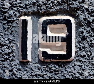 19, number nineteen, black numerals on gray background. Stock Photo