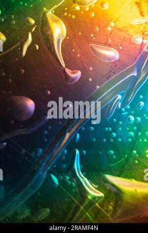 High res macro detail of transparent plastic foil packaging on black surface, design mock up, with rainbow colors , vacuum sealed pouch. Stock Photo