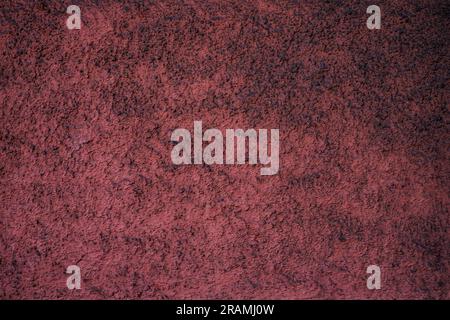 Empty dusty burgundy red textured surface. Stock Photo
