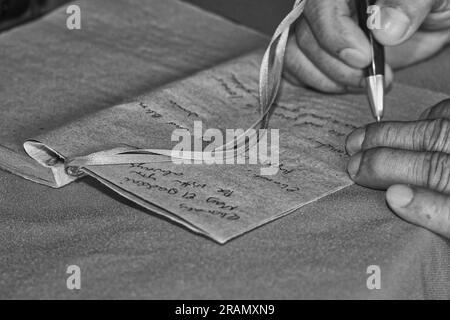 writing a note for someone Stock Photo