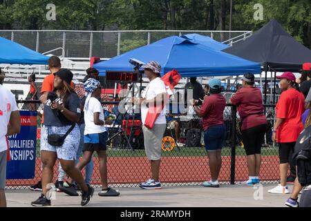 track and field parents, and fans watching and cheering on their children. Stock Photo