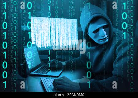 Anonymous man in mask with computers and binary code in darkness Stock Photo