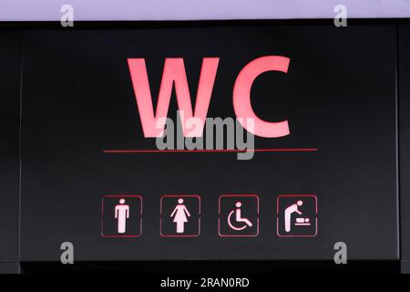 Sign of public toilet with different symbols Stock Photo