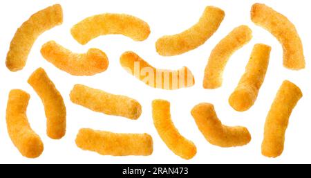 Many tasty corn sticks falling on white background Stock Photo