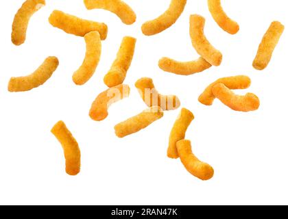 Many tasty corn sticks falling on white background Stock Photo