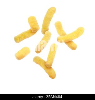Many tasty corn sticks falling on white background Stock Photo