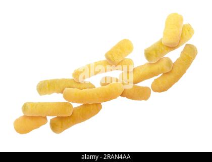Many tasty corn sticks falling on white background Stock Photo