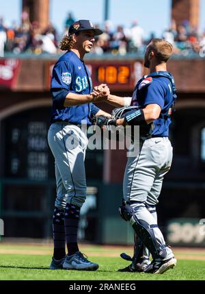 Seattle Mariners catcher Tom Murphy walks past as Texas Rangers' Jason ...