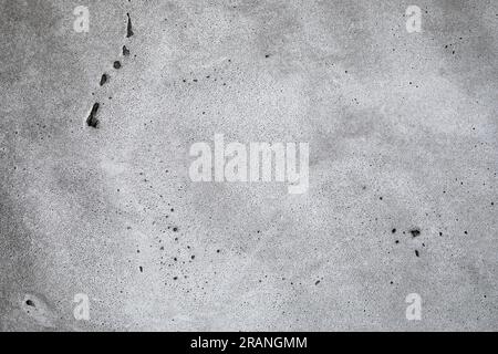 Gray rough concrete texture background with light from the window and soft shadows Stock Photo