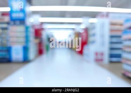 supermarket or minimart aisle and shelves blurred background. bussiness concept Stock Photo