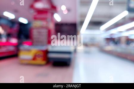 supermarket or minimart aisle and shelves blurred background. bussiness concept Stock Photo