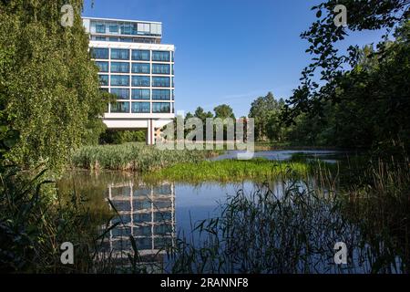 Former Kone Corporation headquarters, now a residential building, by the pond at Munkkiniemenpuistotie 25 in Munkkiniemi district of Helsinki, Finland Stock Photo