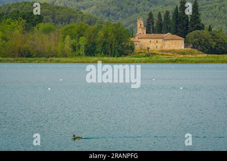 Church of Santa Maria de Porqueres, on the other shore of the lake of Banyoles (Pla de l'Estany, Girona, Catalonia, Spain) Stock Photo