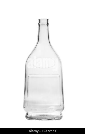 An empty bottle for alcoholic beverages made of transparent glass of a beautiful unusual shape, isolated on a white background. Bottle for cognac, whi Stock Photo