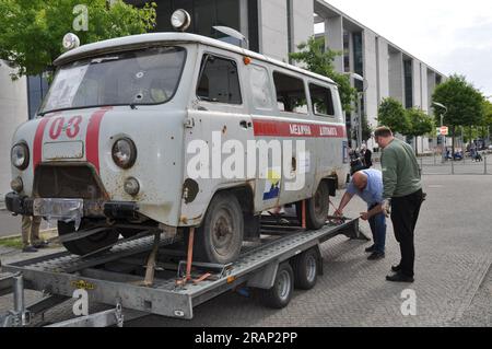 Berlin, Germany. 05th July, 2023. A shot-up ambulance used by Ukrainians in Derhachi near Kharkiv, Ukraine, was installed in front of the parliament in Berlin, Germany, to draw attention to Russian war crimes, on July 5, 2023. Ukrainian, Lithuanian and German activists were behind the action, which was supported by over 20 German lawmakers. Credit: Ales Zapotocky/CTK Photo/Alamy Live News Stock Photo