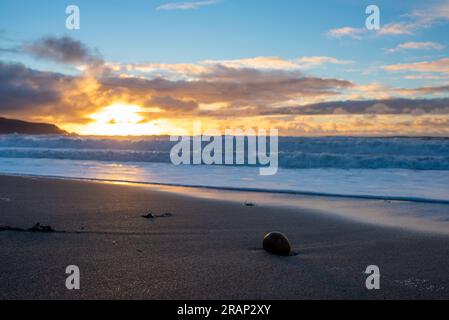 Dramatic sunset on Widemouth Beach in Cornwall, UK Stock Photo