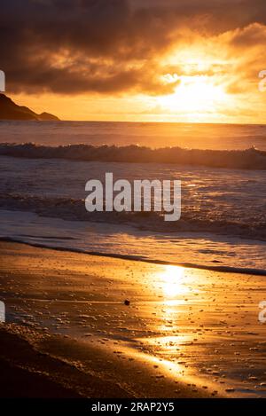 Dramatic sunset on Widemouth Beach in Cornwall, UK Stock Photo