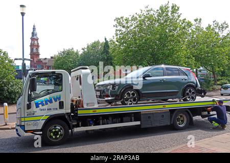Recovering a vehicle crash in St Helens town centre, Lowe St, Merseyside, England, UK, WA10 1HP Stock Photo