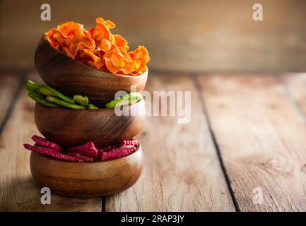 Dried vegetables chips from carrot, beet, parsnip and other vegetables . Organic diet and vegan food. Stock Photo