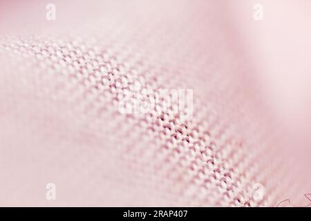 Textured background made with fabric mesh picked up in detail, close up and selective focus. Stock Photo