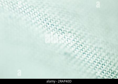 Textured background made with fabric mesh picked up in detail, close up and selective focus. Stock Photo